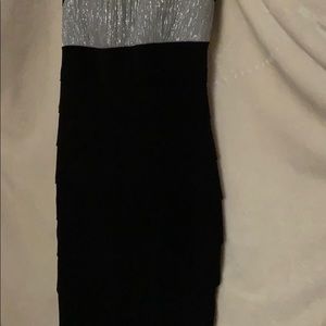 Black dress with a silvery top and thick strap